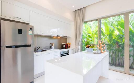 Modern kitchen with island and stainless steel appliances