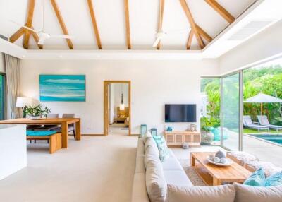 Spacious and bright living area with pool view