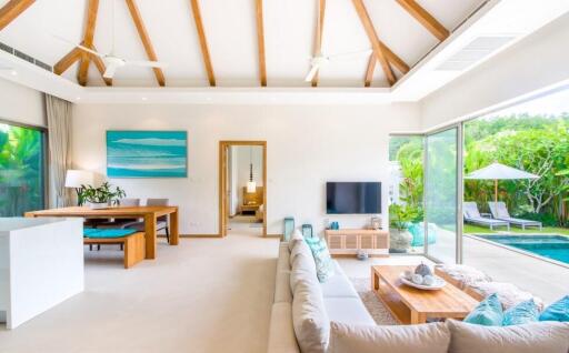 Spacious and bright living area with pool view