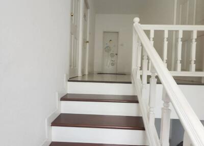 Indoor stairway with white railing