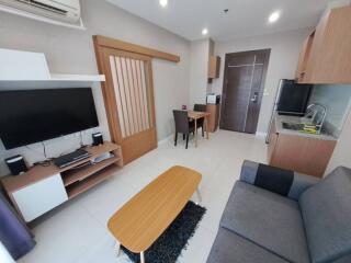 Modern living room with kitchenette and dining area