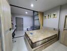 Bedroom with wooden furniture and sliding glass door to living room