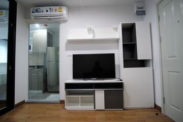 Modern living room with entertainment center and air conditioner