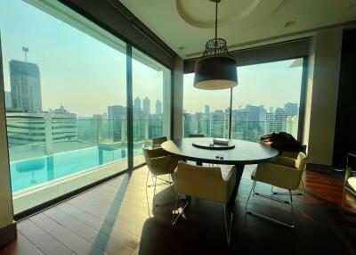 Modern dining area with city view and poolside