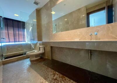 Modern bathroom with large mirror and glass-enclosed shower