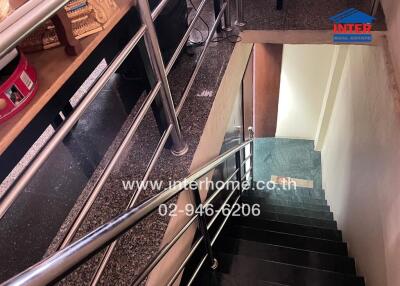 Staircase with steel railing and marble steps
