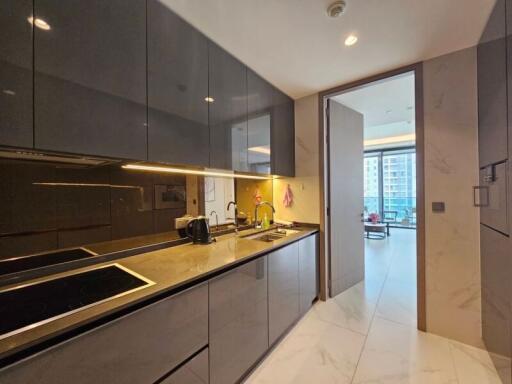 Modern kitchen with sleek black cabinets and built-in appliances