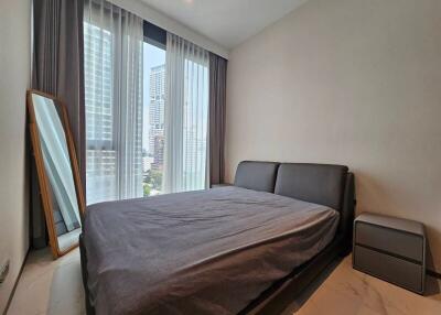 Bedroom with large window and modern decor