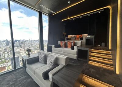 Modern home theater room with stepped seating and city view