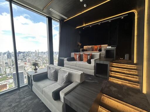 Modern home theater room with stepped seating and city view