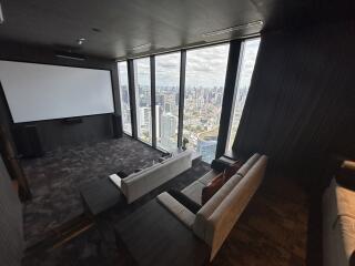 Modern high-rise living room with floor-to-ceiling windows and city view