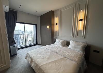 Modern bedroom with double bed and city view
