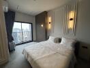 Modern bedroom with double bed and city view