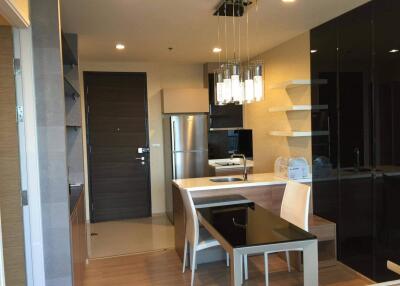 Modern kitchen with dining area and appliances