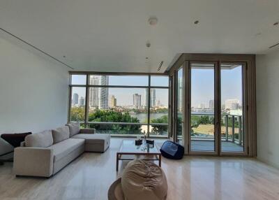 Modern living room with large windows and city view