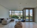 Modern living room with large windows and city view