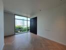 Modern bedroom with large windows and city view