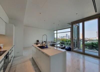 modern open kitchen with living area and city view