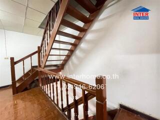 Wooden staircase with wooden railing