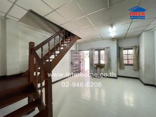 Spacious living room with staircase