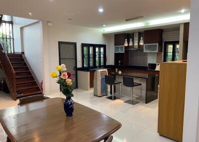 Modern kitchen with dining area and stairway