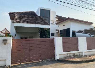 Modern two-story house with a gated front yard