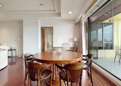 Living space with dining area and access to balcony