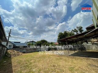 Photo of a backyard with a covered area