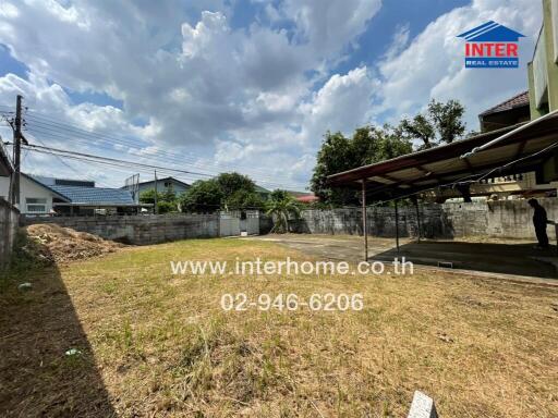 spacious backyard area with covered structure