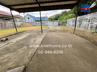 Outdoor area with concrete pavement and shelter