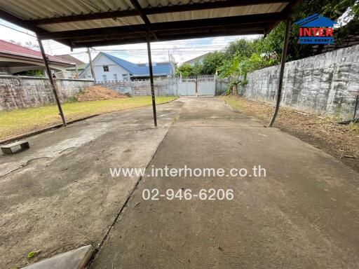 Outdoor area with concrete pavement and shelter