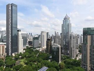 View of modern city skyline with skyscrapers and green spaces