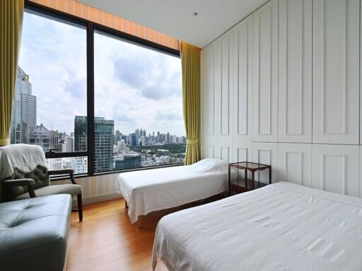 Modern bedroom with two beds and city view