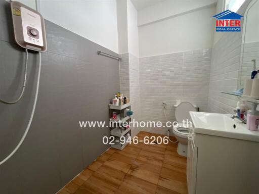 Bathroom with modern amenities and tiled flooring