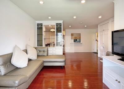 Spacious living room with wooden flooring and modern furnishings