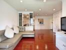 Spacious living room with wooden flooring and modern furnishings