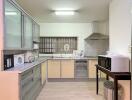 Spacious and modern kitchen with appliances and ample storage space