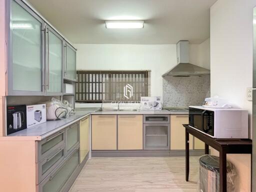 Spacious and modern kitchen with appliances and ample storage space