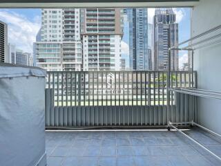 High-rise residential balcony with cityscape view