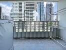 High-rise residential balcony with cityscape view