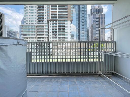 High-rise residential balcony with cityscape view