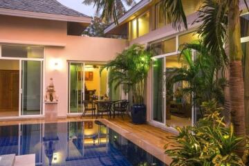 Outdoor view of a modern house with pool and patio