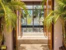 Entrance with open double doors and tropical plants