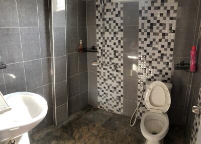 Modern bathroom with tiled walls and floor