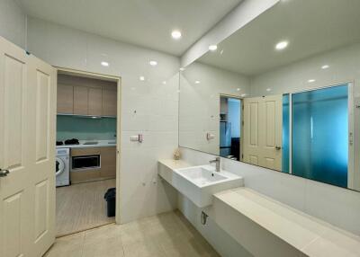 Modern bathroom with large mirror and sink