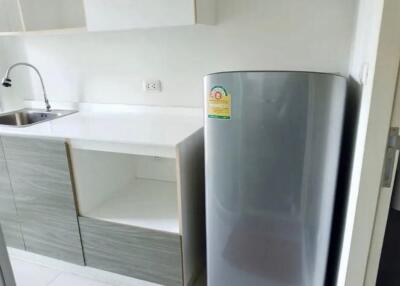 modern kitchen with refrigerator and sink