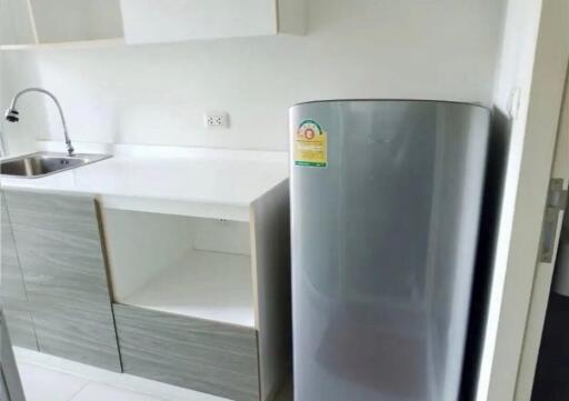 modern kitchen with refrigerator and sink