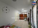 Bedroom with wall clock and window curtains