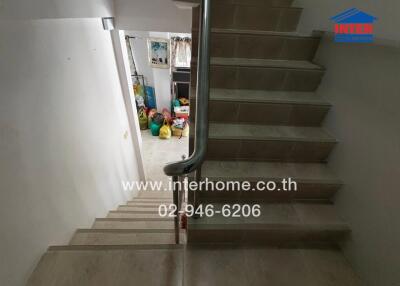 Staircase with view of downstairs area