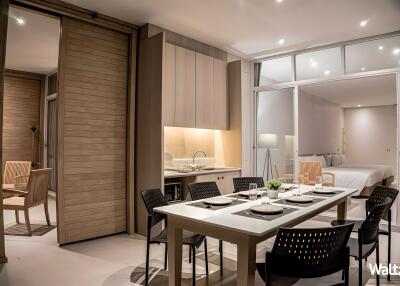 Modern dining area adjacent to the bedroom with a sleek design.